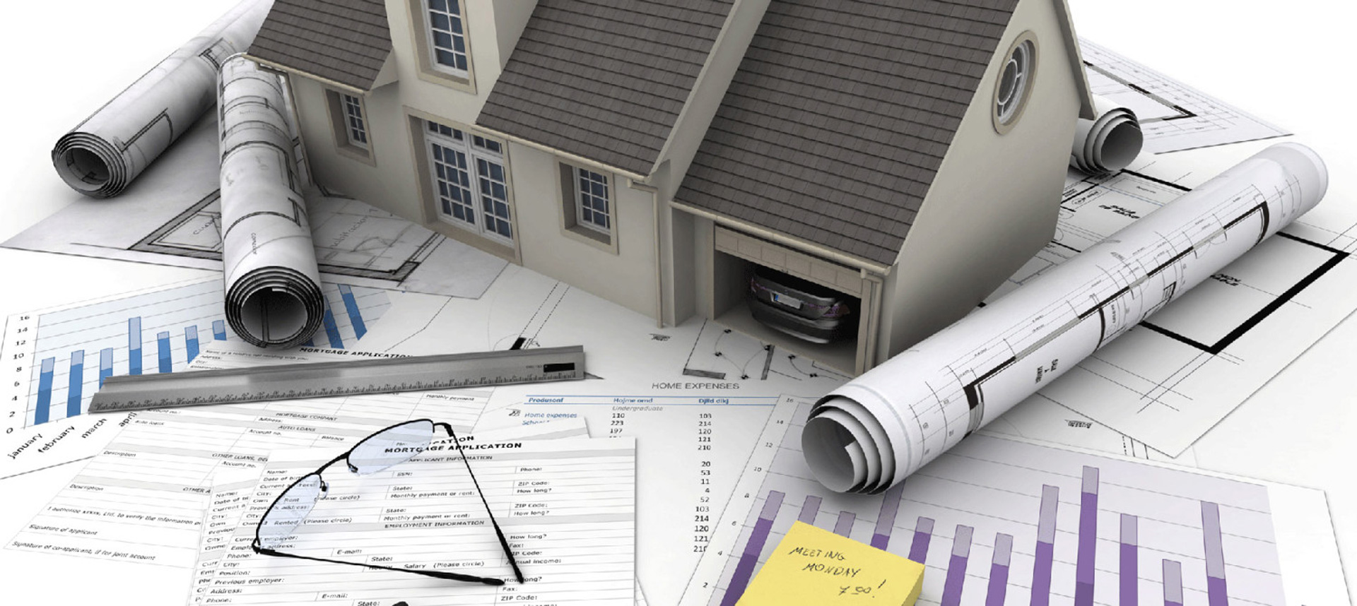 Home plans and a model house on a builder’s desk